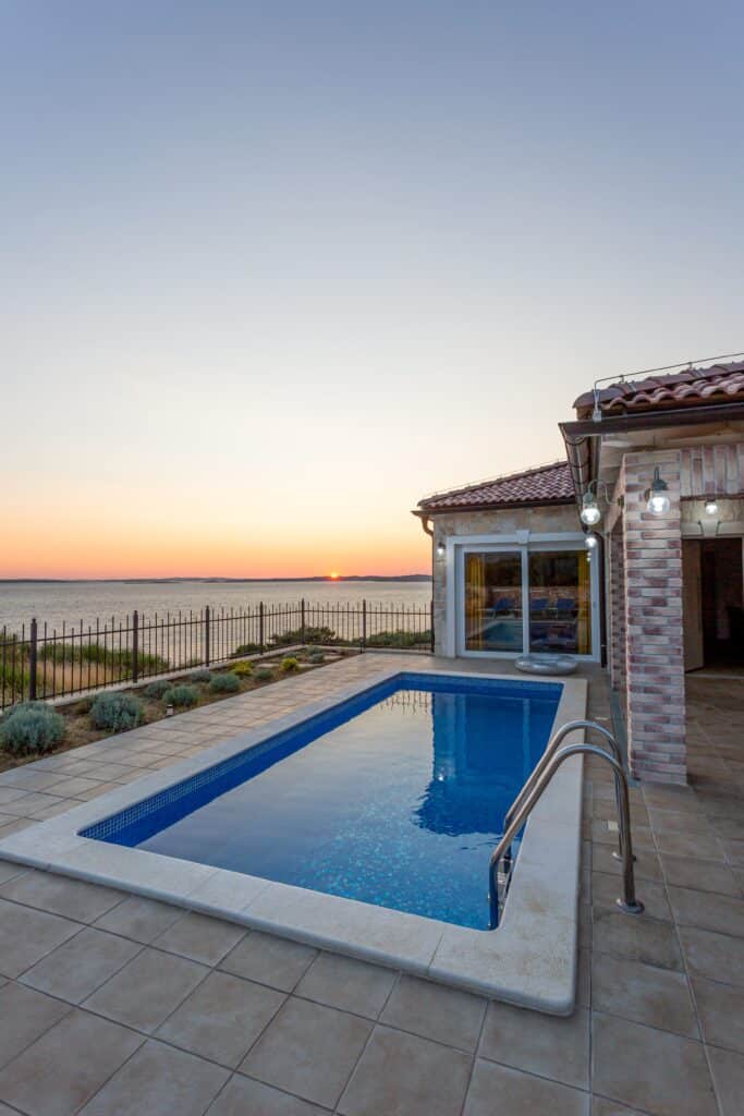 Stone,Villa,With,Terrace,And,Swimming,Pool,At,Sunset
